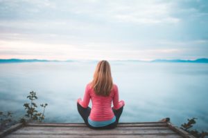 woman at peace on lake